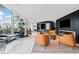 Stylish lounge area with a fireplace, modern seating, and city views at 400 W Peachtree Nw St # 1408, Atlanta, GA 30308