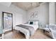 Comfortable main bedroom with city views, soft lighting, and minimalist design elements at 400 W Peachtree Nw St # 1408, Atlanta, GA 30308