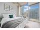 Serene main bedroom with large windows offering scenic cityscape views and a comfortable bed at 400 W Peachtree Nw St # 1408, Atlanta, GA 30308