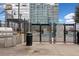 Poolside area with a barbecue, fencing and signs with pool rules and emergency number at 400 W Peachtree Nw St # 1408, Atlanta, GA 30308
