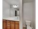 Bathroom featuring a vanity with ample cabinet space and well-lit mirror at 5107 Madeline Pl, Stone Mountain, GA 30083