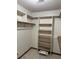 Walk-in closet with built-in shelving provides ample storage space at 5207 W Shore Sw Dr, Conyers, GA 30094