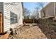 Cozy backyard with a wood fence and a small garden at 5532 Riverside Dr, Sugar Hill, GA 30518