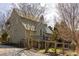 Charming home with a metal roof, wood fence, and a welcoming front porch at 10528 Serenbe Ln, Chattahoochee Hills, GA 30268