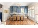Eat-in kitchen with blue cabinets, a large window, and a dining table with seating at 10528 Serenbe Ln, Chattahoochee Hills, GA 30268