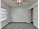 Bedroom with plush gray carpet, closet storage and a bright window at 1284 Warsaw Rd, Roswell, GA 30076