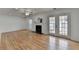 Inviting living room with fireplace, hardwood floors, and access to the backyard at 1284 Warsaw Rd, Roswell, GA 30076