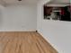 Bright living room featuring wood floors and a pass-through to the updated kitchen at 1284 Warsaw Rd, Roswell, GA 30076