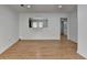 Spacious living room with hardwood floors and views to the front entrance and kitchen at 1284 Warsaw Rd, Roswell, GA 30076