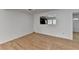 Open floorplan with hardwood floors and a view to the kitchen and front door at 1284 Warsaw Rd, Roswell, GA 30076