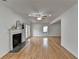 Spacious living room featuring a fireplace, french doors, and hardwood floors at 1284 Warsaw Rd, Roswell, GA 30076