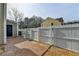 This back patio features brick pavers, a door to the house, and a fenced area at 1284 Warsaw Rd, Roswell, GA 30076