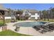 Gorgeous backyard featuring an in-ground pool, patio seating, and beautiful landscaping at 5222 N Helton Rd, Winston, GA 30187