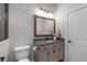 Elegant bathroom with granite countertop, framed mirror, and soft-close cabinets, offering a blend of style and functionality at 5222 N Helton Rd, Winston, GA 30187