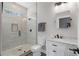 Beautiful bathroom featuring tiled walls, a glass shower, brushed bronze fixtures, and modern vanity at 5222 N Helton Rd, Winston, GA 30187
