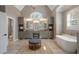 Elegant bathroom with double sink vanity and stylish soaking tub under a window at 5222 N Helton Rd, Winston, GA 30187