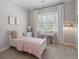 Cozy bedroom with a white bed frame, a work desk, and ample natural light at 5222 N Helton Rd, Winston, GA 30187