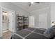 Cozy bedroom features a view into the ensuite bathroom and displays a comfortable bed and decorative shelving at 5222 N Helton Rd, Winston, GA 30187