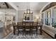 Dining room with a large table, chairs, and a view of the kitchen and backyard at 5222 N Helton Rd, Winston, GA 30187
