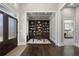 Inviting entryway with hardwood floors, adjacent office, and views into the bedroom at 5222 N Helton Rd, Winston, GA 30187