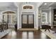 Grand entrance foyer featuring hardwood floors, large windows, and stylish decor at 5222 N Helton Rd, Winston, GA 30187