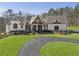 Stunning home with a circular driveway and expertly manicured lawn at 5222 N Helton Rd, Winston, GA 30187