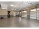 Spacious garage with epoxy floors, ample storage, and multiple doors for easy access at 5222 N Helton Rd, Winston, GA 30187