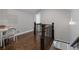 Stylish hallway features hardwood floors, a reading nook, and elegant lighting, creating an inviting transition space at 5222 N Helton Rd, Winston, GA 30187