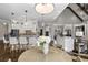 Bright kitchen open to the breakfast nook with white cabinets, granite counters and stainless appliances at 5222 N Helton Rd, Winston, GA 30187