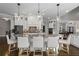 Modern kitchen with white cabinetry, granite countertops, stainless steel appliances, and a breakfast bar at 5222 N Helton Rd, Winston, GA 30187