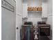 Well-organized laundry room with modern front-load washer and dryer at 5222 N Helton Rd, Winston, GA 30187
