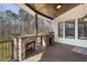 Covered outdoor kitchen featuring a stone fireplace, built-in grill, and ample counter space for cooking at 5222 N Helton Rd, Winston, GA 30187