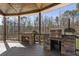 Covered outdoor kitchen with a fireplace, built-in grill, and countertop space perfect for entertaining at 5222 N Helton Rd, Winston, GA 30187