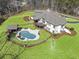 Aerial view of the backyard, with a private pool, and spacious yard at 5222 N Helton Rd, Winston, GA 30187
