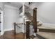 Beautiful staircase with wood railings, carpeted steps, and open design, adding a touch of elegance to the home's interior at 5222 N Helton Rd, Winston, GA 30187