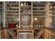 Custom wine cellar showcasing ample storage, wooden shelving, and a built-in beverage cooler at 5222 N Helton Rd, Winston, GA 30187