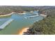 Gorgeous aerial view of Lake Lanier featuring boat docks and sandy beach, creating a relaxing atmosphere at 5400 Kings Camp Rd Se B-34, Acworth, GA 30102
