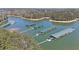 Picturesque aerial view of Lake Lanier highlighting covered boat docks and lush green forests, ideal for boating at 5400 Kings Camp Rd Se B-34, Acworth, GA 30102