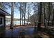 Enjoy lake views from the wooden deck in the backyard at 5400 Kings Camp Rd Se B-34, Acworth, GA 30102