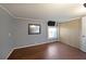 Cozy bedroom featuring wood floors, a large window, and a mirror at 5400 Kings Camp Rd Se B-34, Acworth, GA 30102