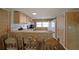 Efficient kitchen with wood-look walls, bar seating, and modern appliances, maximizing space and functionality at 5400 Kings Camp Rd Se B-34, Acworth, GA 30102