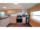 Bright kitchen featuring stainless steel appliances and wood cabinets at 5400 Kings Camp Rd Se B-34, Acworth, GA 30102