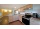 Open kitchen boasts stainless steel appliances and granite countertops at 5400 Kings Camp Rd Se B-34, Acworth, GA 30102