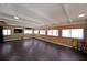 Spacious living room featuring hardwood floors, a beamed ceiling, and abundant natural light at 5400 Kings Camp Rd Se B-34, Acworth, GA 30102