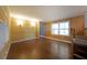 Inviting living room with wood-look walls, great natural light, and hardwood-style flooring at 5400 Kings Camp Rd Se B-34, Acworth, GA 30102