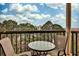 Private balcony offering seating and views of lush greenery and city skyline at 1 Biscayne Nw Dr # 706, Atlanta, GA 30309