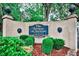 Entrance sign of The Terraces at Peachtree Condominiums surrounded by manicured landscaping at 1 Biscayne Nw Dr # 706, Atlanta, GA 30309