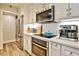 Well-equipped kitchen features stainless steel appliances, white cabinets, and modern countertops at 1 Biscayne Nw Dr # 706, Atlanta, GA 30309