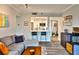 Open concept living area featuring a breakfast bar and gray sectional sofa at 1 Biscayne Nw Dr # 706, Atlanta, GA 30309