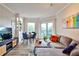Cozy living room with hardwood floors, lots of natural light, and dining area at 1 Biscayne Nw Dr # 706, Atlanta, GA 30309
